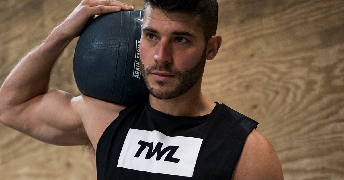 male athlete holding slam ball