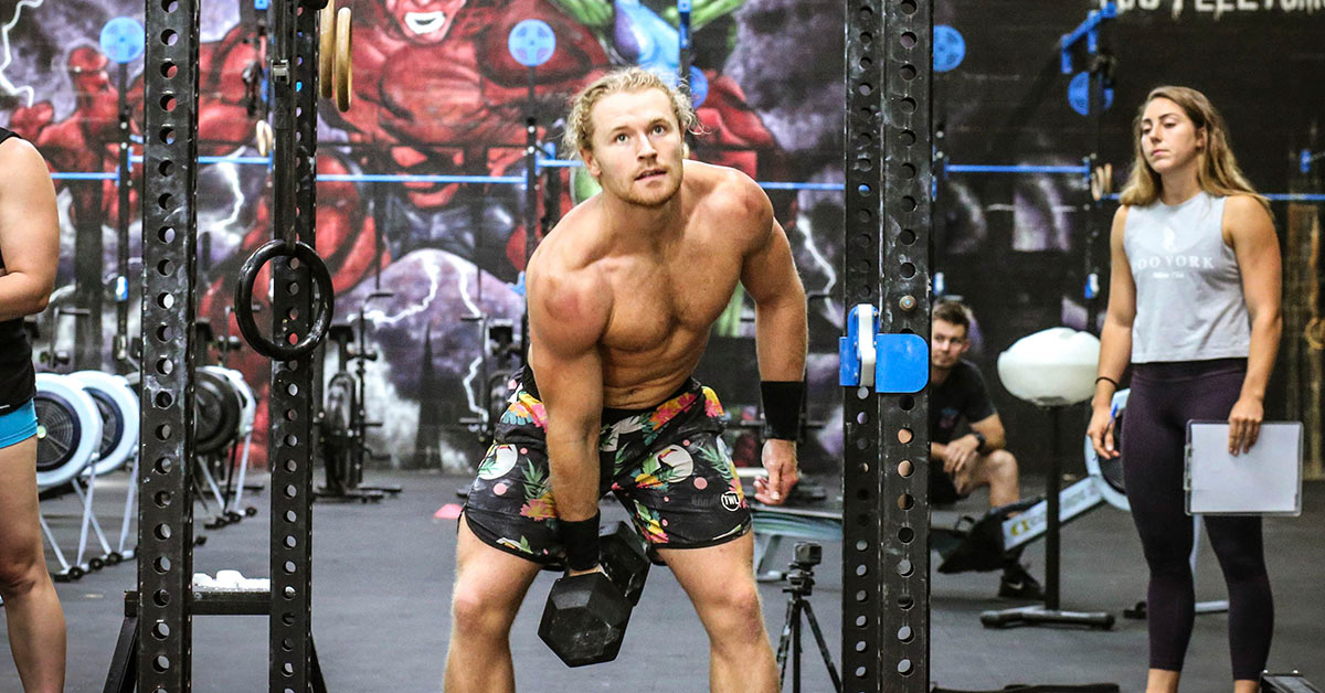 athlete doing dumbbells wods