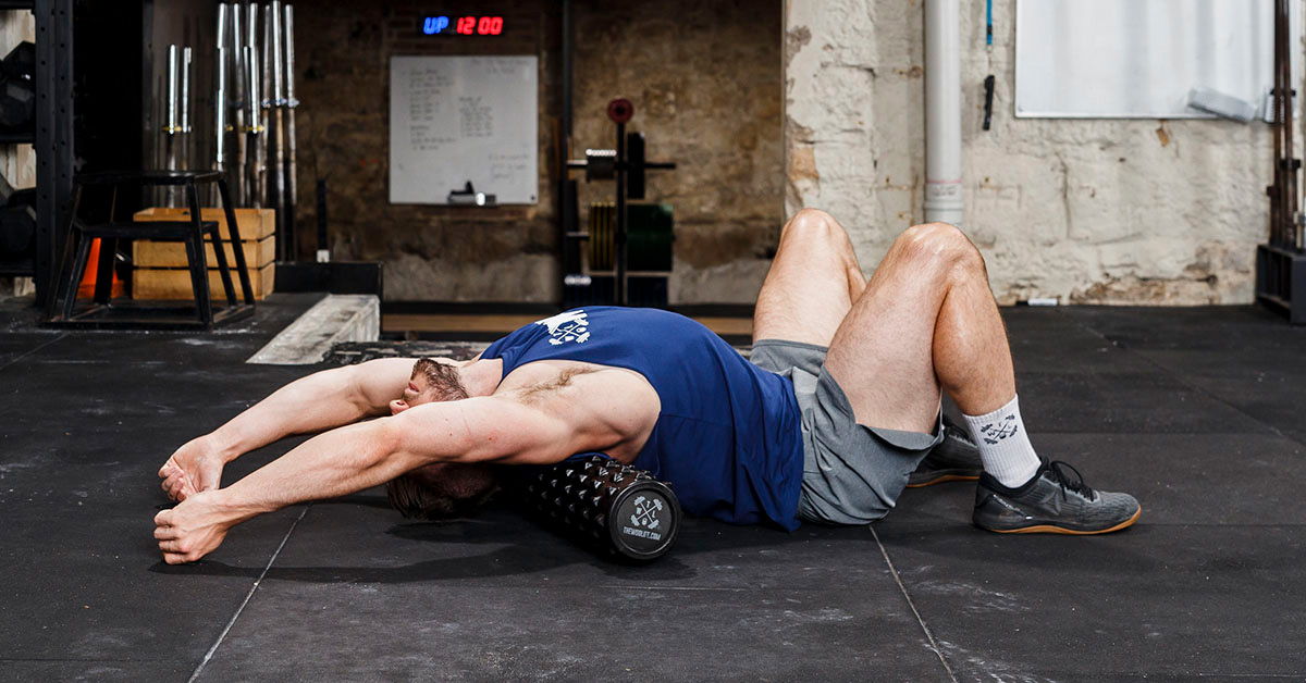 athlete rolling out back on foam roller