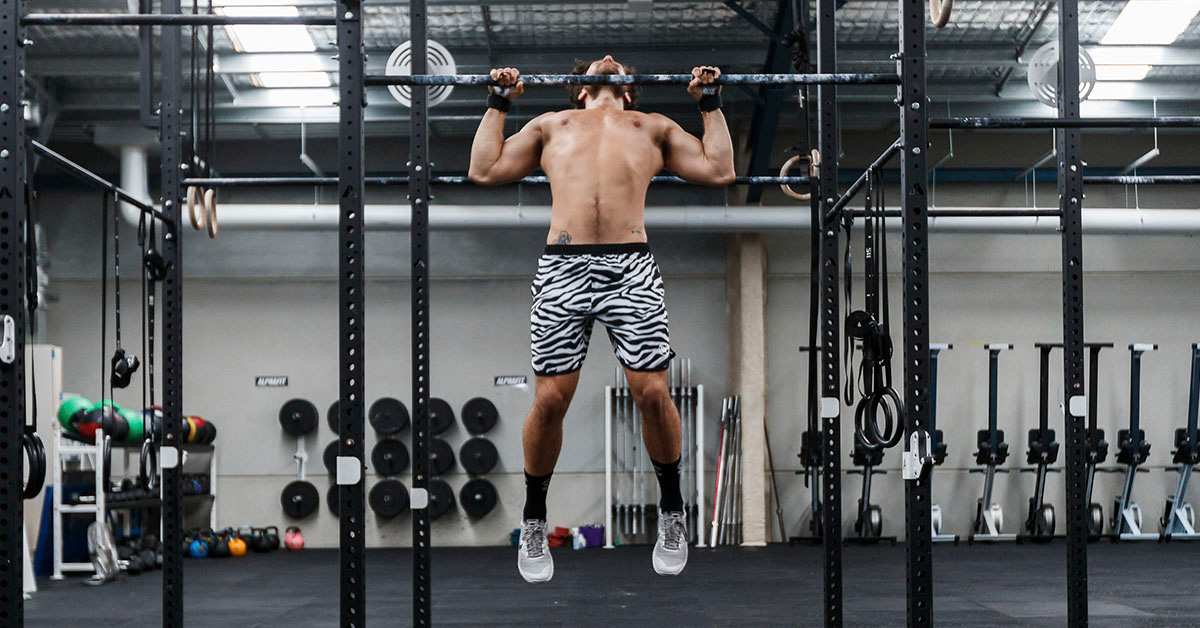 khan doing chest-to-bar butterfly pull-ups