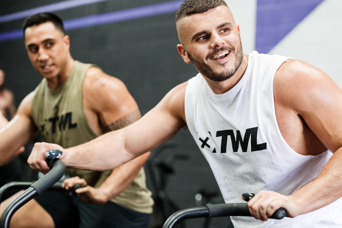 male athlete smiling at the gym