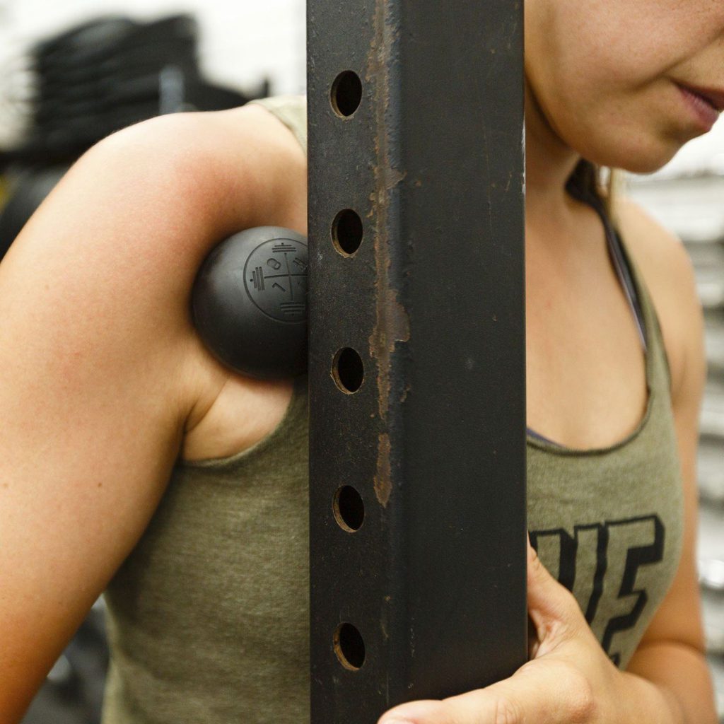 woman using lacrosse ball