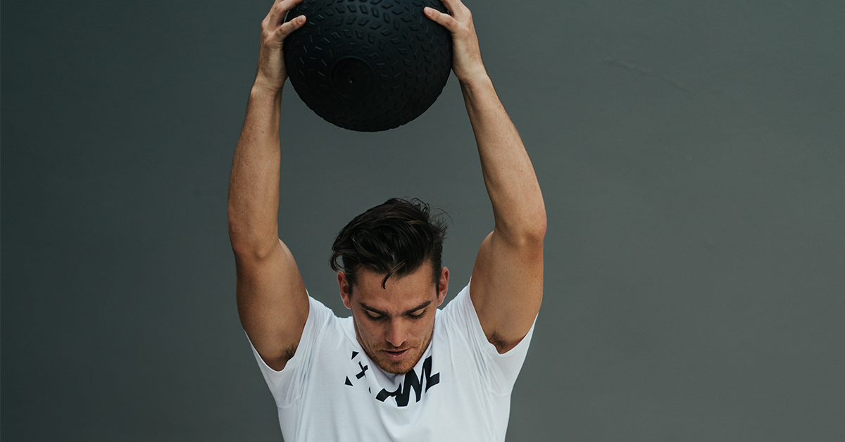 athlete doing medicine ball exercises