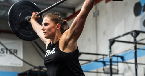 female athlete using olympic barbell