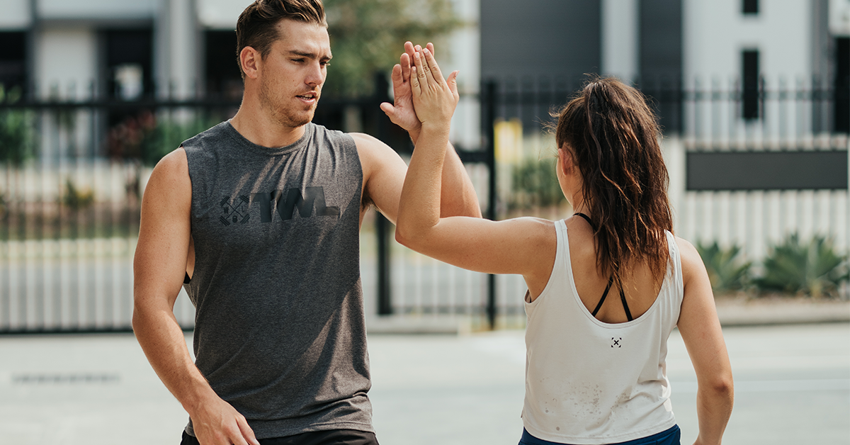 two athletes high-fiving