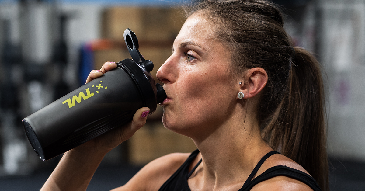 athlete drinking protein shake