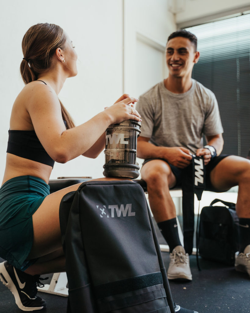 female athlete following nutrition tips and drinking water