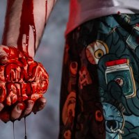 zombie holding brain in hand