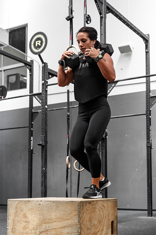 athlete performing dumbbell squat