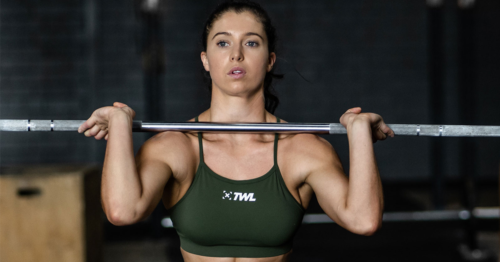 female athlete doing barbell front squat