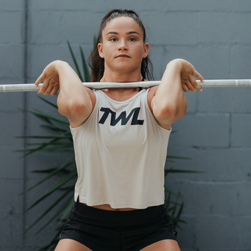 female athlete performing power clean