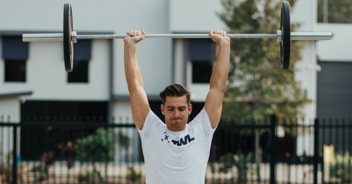 male athlete doing push press