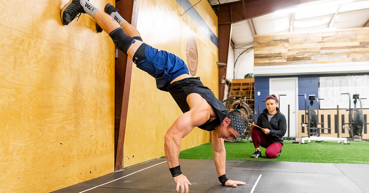 athlete doing wall walk
