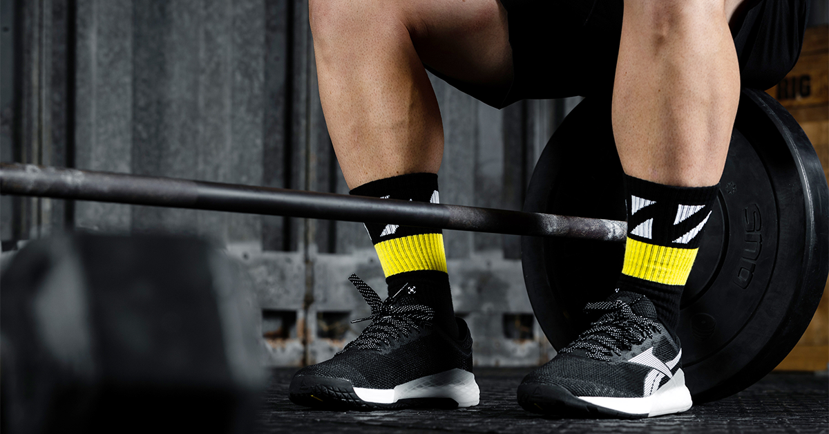 athlete preparing for landmine squat