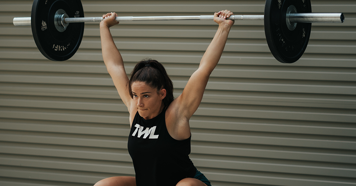 female athlete doing Sots press