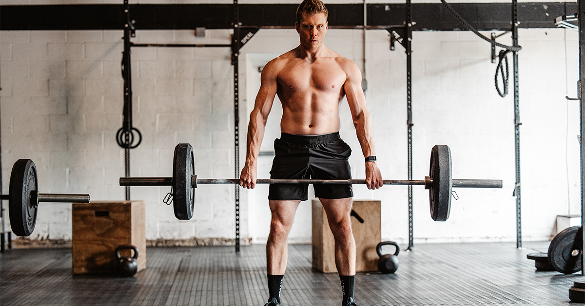 man doing stiff leg deadlift