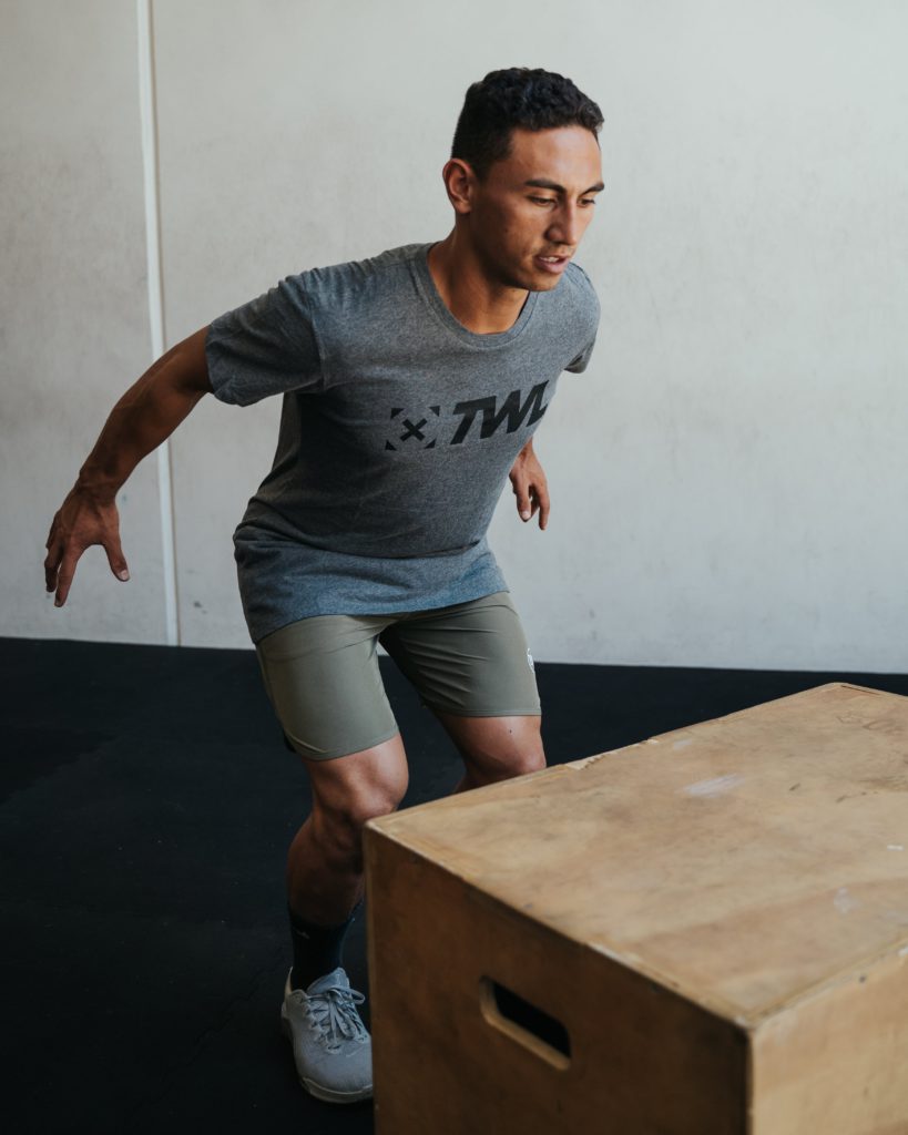athlete performing box jumps