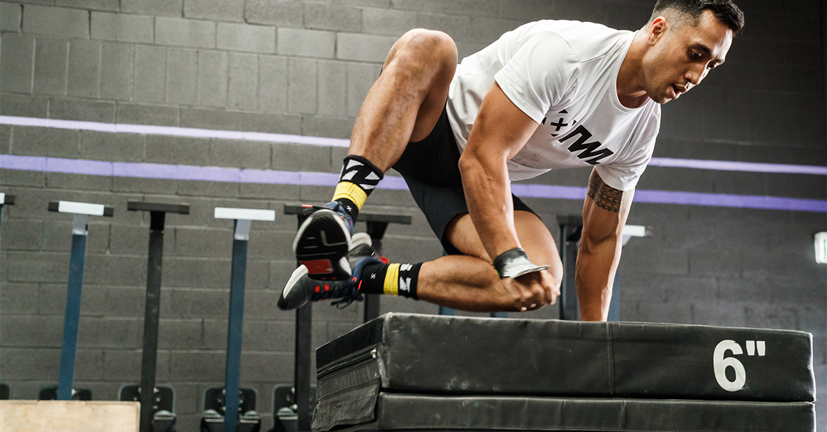 athlete performing box jumps