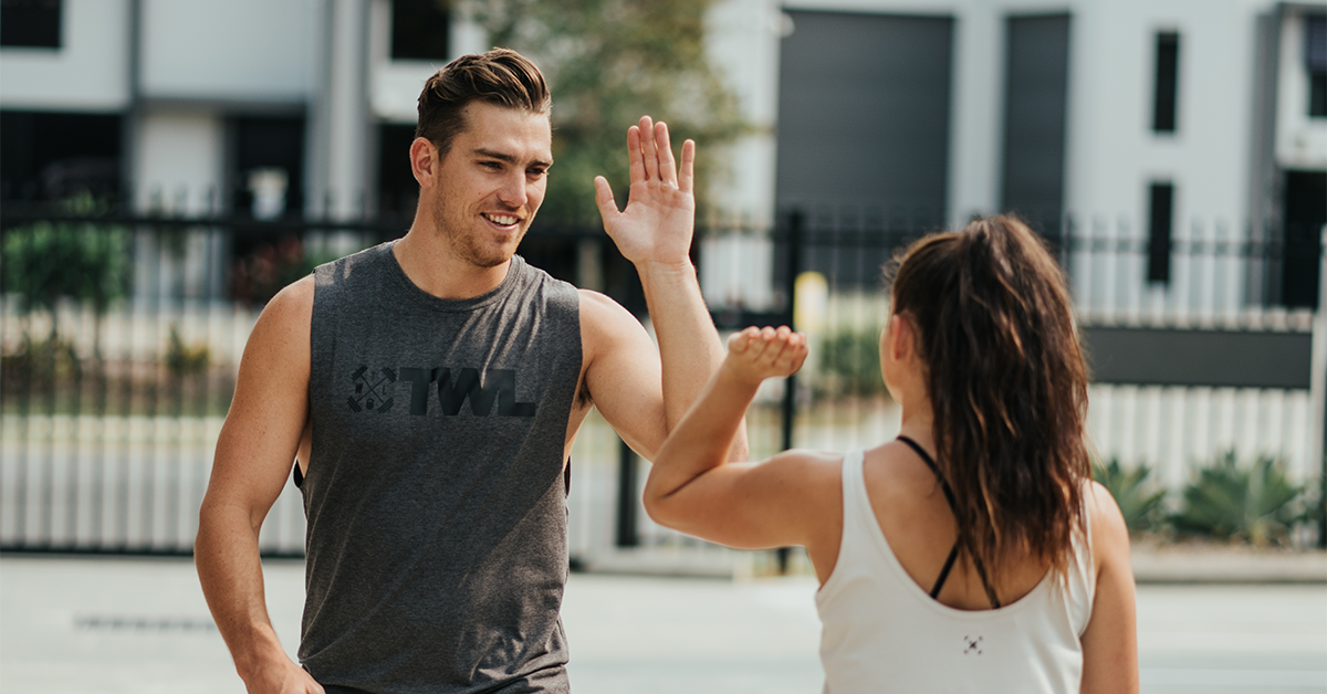 two athletes giving high fives