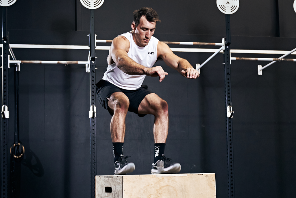 athlete doing box jump