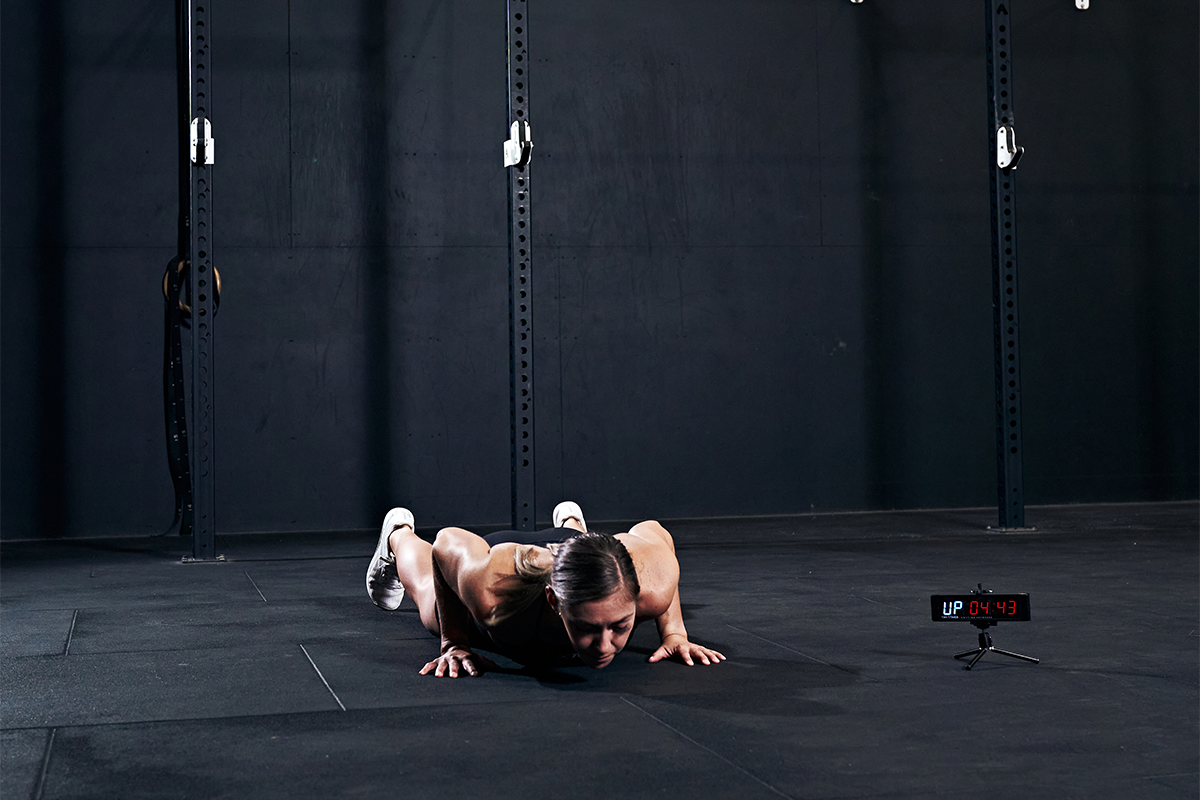 female athlete doing burpee