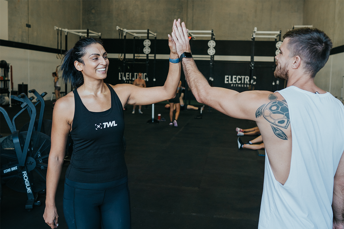 two athletes giving high five