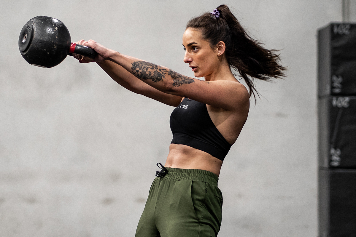 female athlete doing Russian kettlebell swing