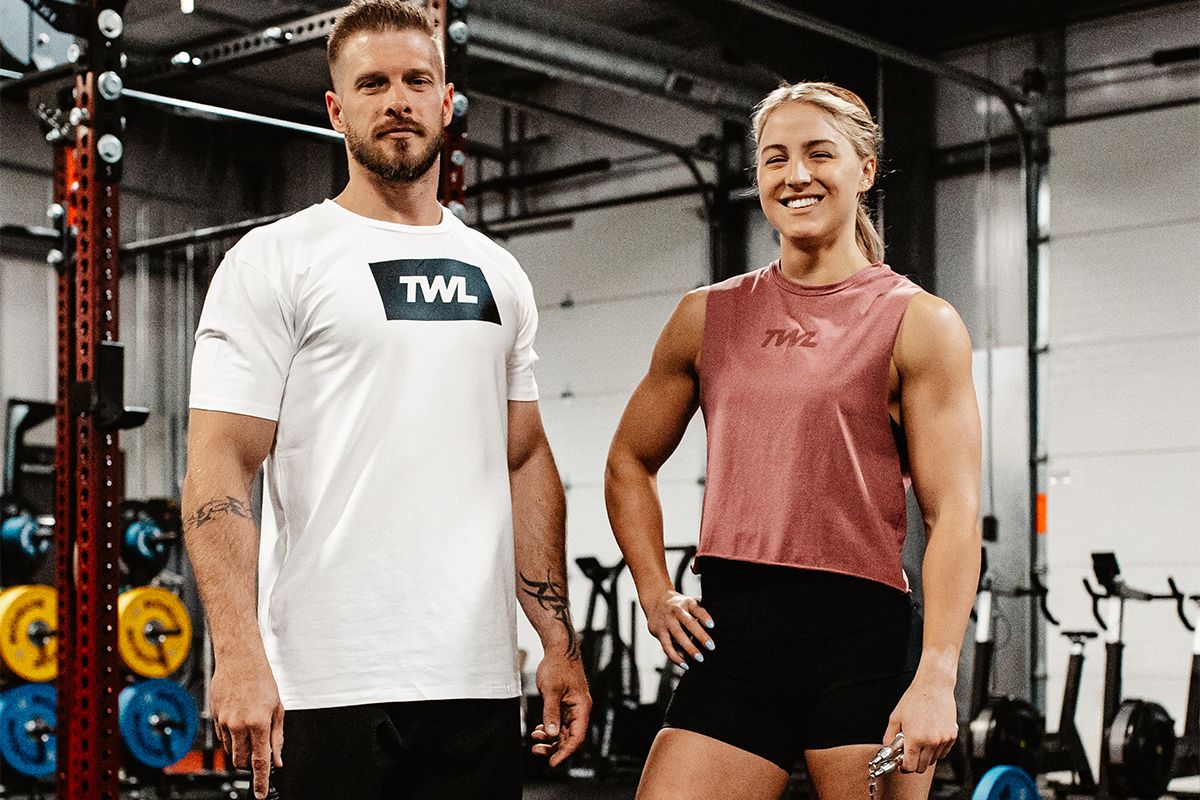 male and female athlete smiling