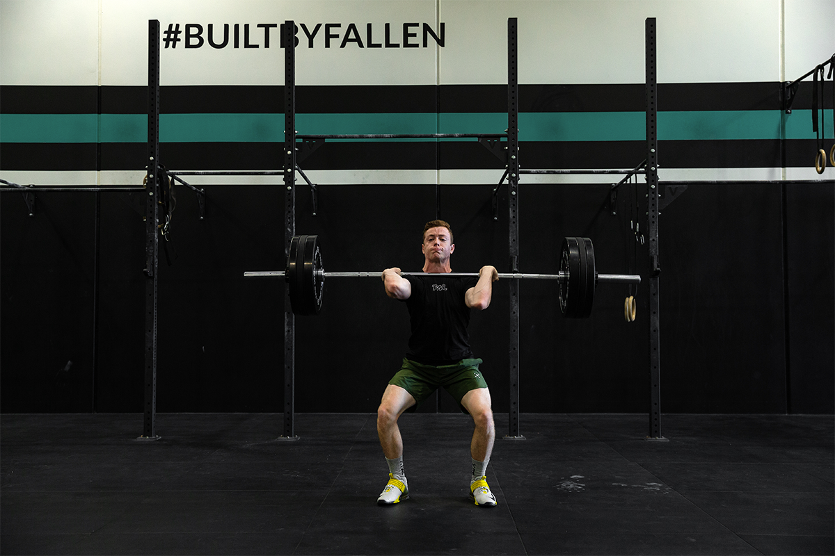 male athlete doing clean and jerk