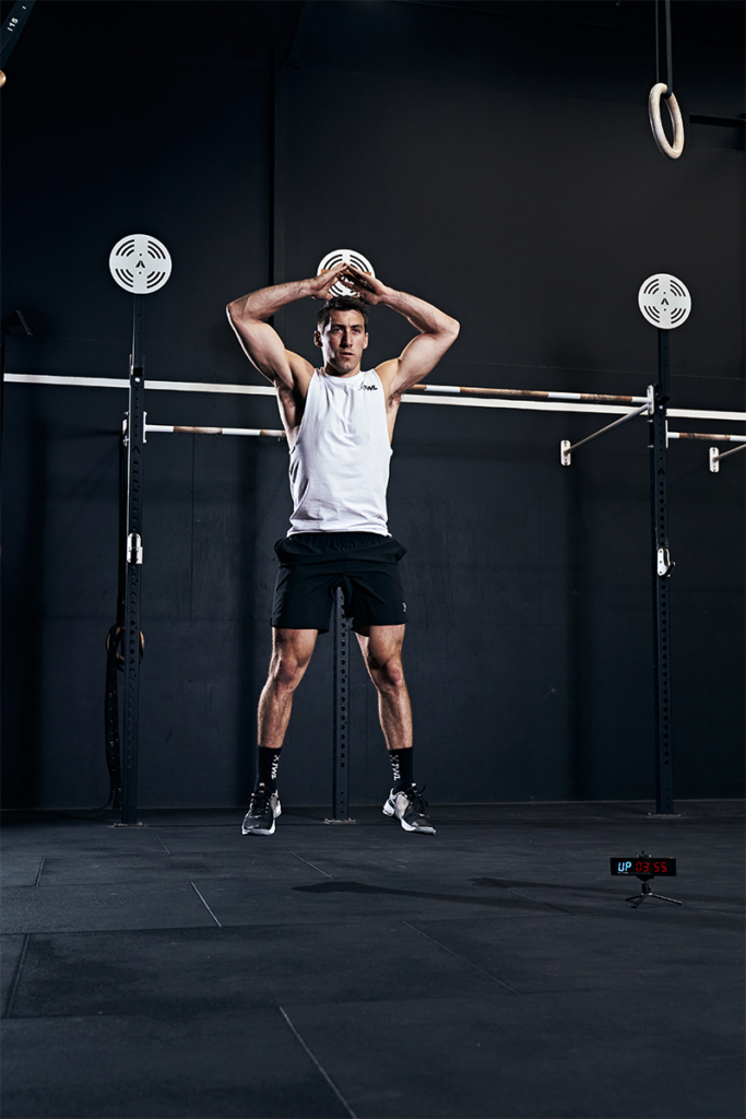 male athlete performing burpee