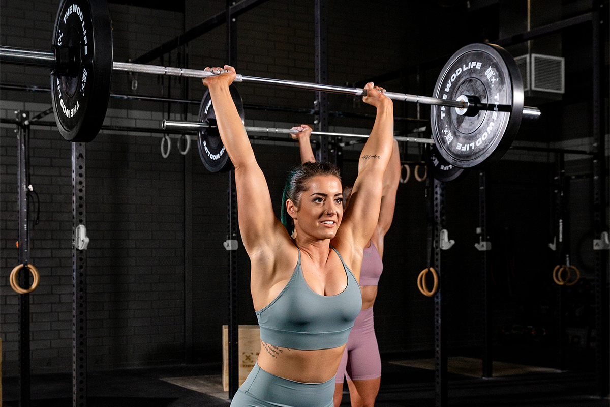 woman doing clean and jerk warmup