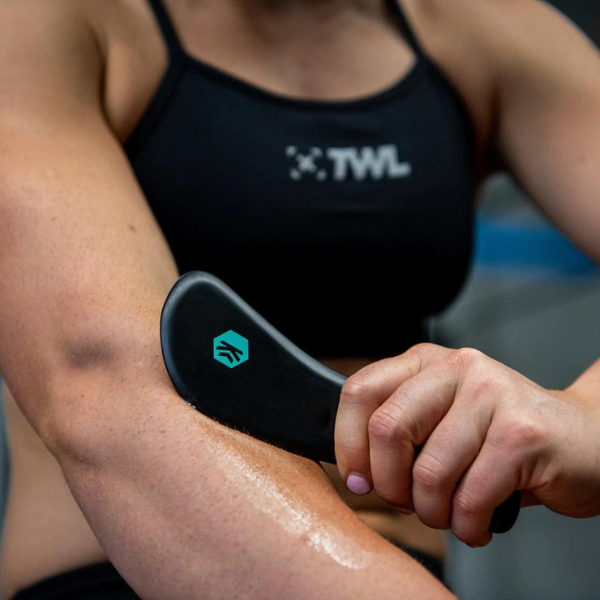 athlete muscle scraping their forearm