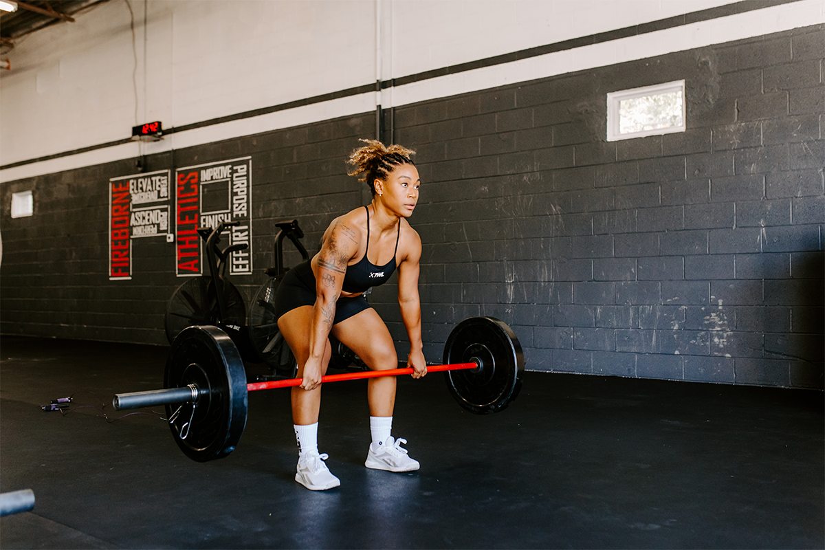 female doing deadlift