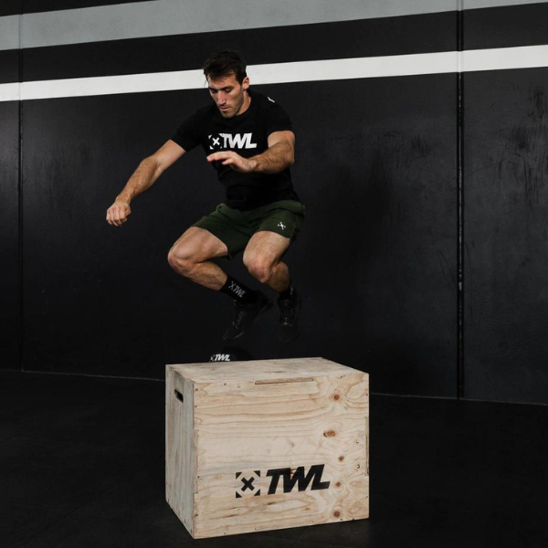 man performing box jumps