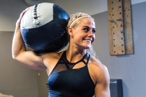 Sara Sigmundsdottir holding med ball on shoulder