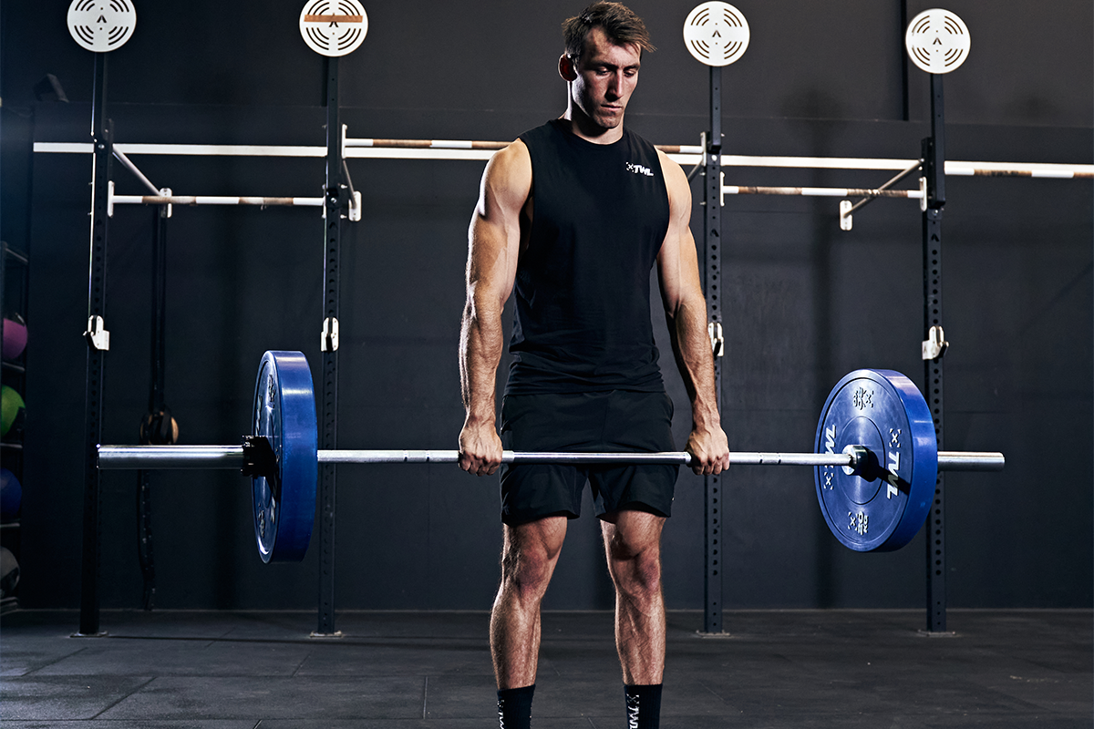 athlete doing deficit deadlift